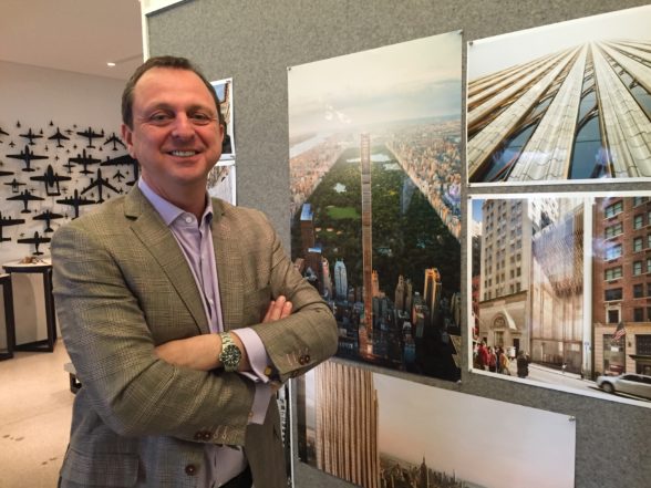 Gregg Pasquarelli with renderings of 111 W 57th Street