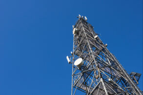 Telecommunication tower with clear blue sky background. Antenna on blue sky. Radio and satellite pole. Communication technology. Telecommunication industry. Mobile or telecom 4g and 5g network.