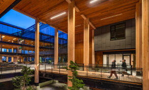 Five-story mixed-use building boasting a mass-timber structural system via cross-laminated timber, glued-laminated columns, and girders. Source: Swinerton