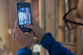 Sitewire mobile app depicted on a screen at a jobsite