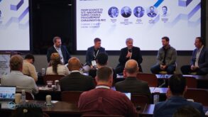 Five businessmen address a crowd.