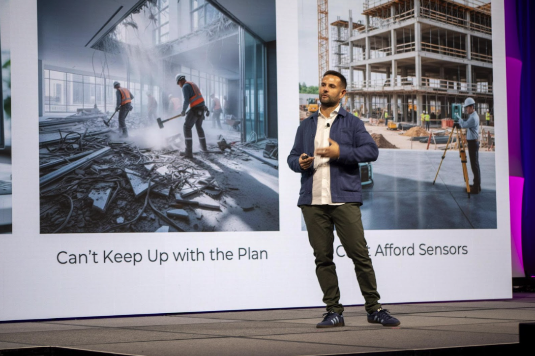 Professional in casual dress giving a presentation in front of a large screen