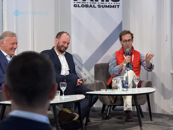 three men on stage at the 2026 paris global summit talking about automation in construction