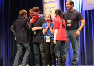 Winning Moment: Along with project mentor and engineer Nick Samsa (far right), students participating in the West Ridge Middle Schools entry revel in the news their project has taken first place.